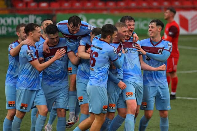 Institute goal scorer Evan Tweed (third from right) celebrates with teammates. Photograph: George Sweeney