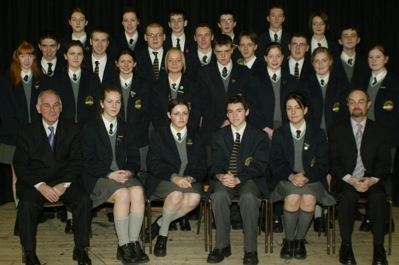 Students from Lumen Christi College who received a minimum of 10 As or A*s in their recent GCSE exams pictured with school principal Mr. Declan O'Kelly and Mr Pat O'Doherty. (1001JB26)