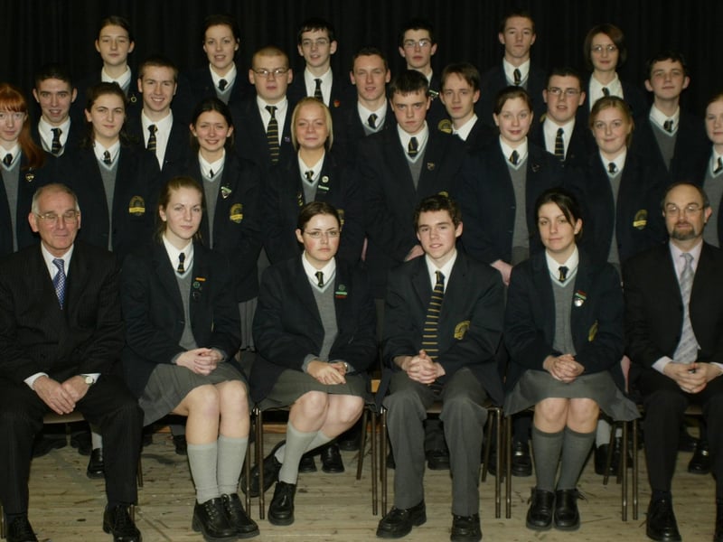Students from Lumen Christi College who received a minimum of 10 As or A*s in their recent GCSE exams pictured with school principal Mr. Declan O'Kelly and Mr Pat O'Doherty.  (1001JB26)