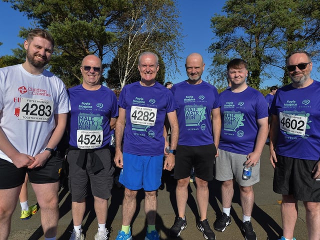 David McCafferty (left) and friends took part in the annual Foyle Hospice Run/Walk. David recently completed a fund raising pull of a fire engine for Children in Crossfire. Photo: George Sweeney