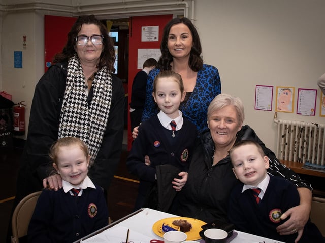 Holy Child PS Principal, Mrs. Pat Concannon pictured with some of the pupils and their grandmothers.