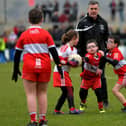 ARE YOU WATCHING, RORY? Some of the children who took part in a football game during half-time at Owenbeg on Sunday.  Photo: George Sweeney. DER2312GS – 32