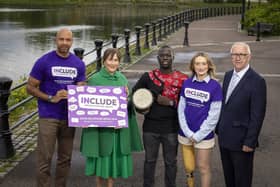 Pictured supporting the call for events ahead of Good Relations Week 2026 are Bernadette Hagans, campaigner and disability advocate; Ibe Sesay, broadcaster and DJ; Aroma Kennedy, originally from Uganda, performing with his African drum; Moira Doherty, Permanent Secretary of The Executive Office; and Martin McDonald MBE, Chair of the Community Relations Council.