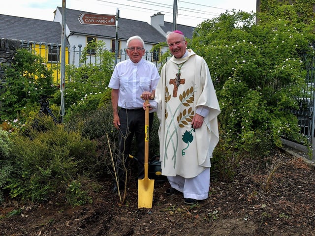 Fr Con McLaughlin PP, pictured with the Most Reverend Dr Donal McKeown, Bishop of Derry, after planting a tree, in the grounds of the Church of the Sacred Heart, Carndonagh, on Saturday evening, to mark the occasion of his Golden Jubilee in the priesthood. Photo: George Sweeney. DER2323GS – 170