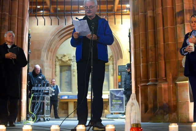 Frank Galligan reads a poem at a candlelit vigil, held at Guildhall Square on Monday evening, to remember those who died in the Creeslough tragedy on Friday afternoon last.  Photo: George Sweeney.  DER2241GS – 53   