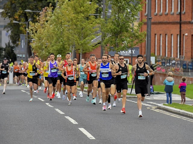 First Wave runners in the Waterside Half Marathon make their way out of Ebrington Square towards Limavady Road. Photo: George Sweeney
