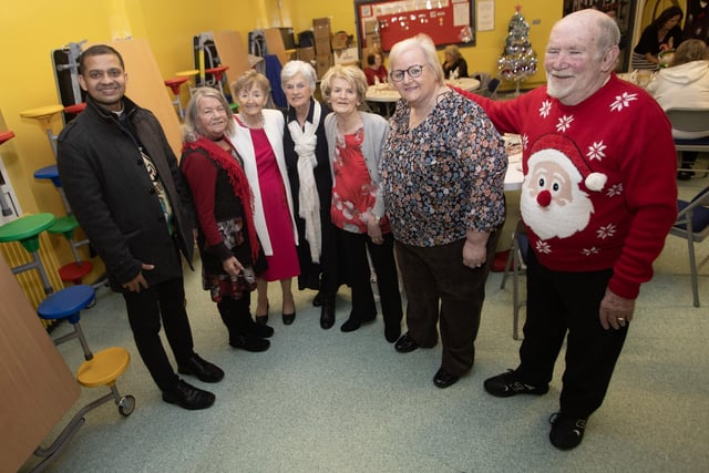 Fr. Roni pictured with some of the folk at Friday night's St. Paul's Annual Christmas Pensioners' Dinner. From left, Chris Harkin, Maureen Bradley, Kathleen Clifford, Brigid Nicholl, Bernadette Wilkinson and Kelvin Kerr. (Photos: Jim McCafferty Photography)