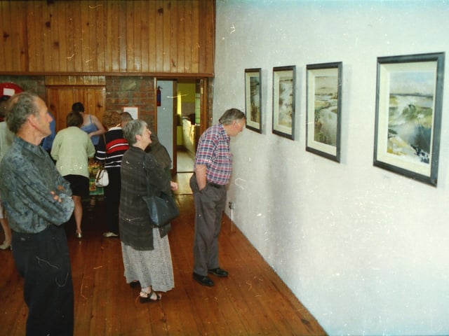 Members of the public enjoy an exhibition at Tullyarvan Mill.