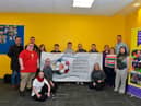 Group pictured in the Foyle Down Syndrome Trust’s offices in The Shared Future centre, Waterside, at the launch of the National Children’s Football Alliance sponsored ‘Football makes our Shared History ‘project.  Included in the photograph are Ernie Brennan, managing director, National Children’s Football Alliance, on the left, staff members Conor McGilloway and Sue McElwee and Christopher Cooper, manager FDST. Photo: George Sweeney.  DER2206GS – 066