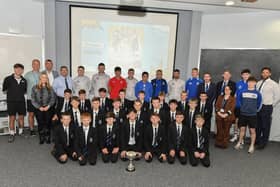 Former pupils, now professional footballers, school staff and coaches and the Under 12 team pictured at a celebration of the U12 soccer team winning the NI Schools Cup three years in a succession. Photograph: George Sweeney