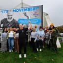 Group pictured at the launch of Hive's 'Movember' campaign billboard at Free Derry Wall. The board features a picture of Hives Male Support Worker Martin Mullan. Movember is an annual event involving the growing of moustaches during the month of November to raise awareness of awareness of mens mental health & prostate and testicular cancer. Included in the group photograph is Martin Mullan. Photo: George Sweeney