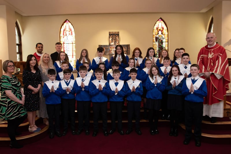 ST. PAUL'S PS CONFIRMATION . . . . .Pupils from St. Paul's Primary School who received the Sacrament of Confirmation from Fr. McGrattan at St. Joseph's Church, Galliagh on Friday last. Included in photo, fromleft, Ms Quinn, asst, Mrs McKinney, asst, Ms McGinty, P7 teacher, Fr Roni Zacharias, Noel Gallagher, seminarian. (Photos: Jim McCafferty Photography)
