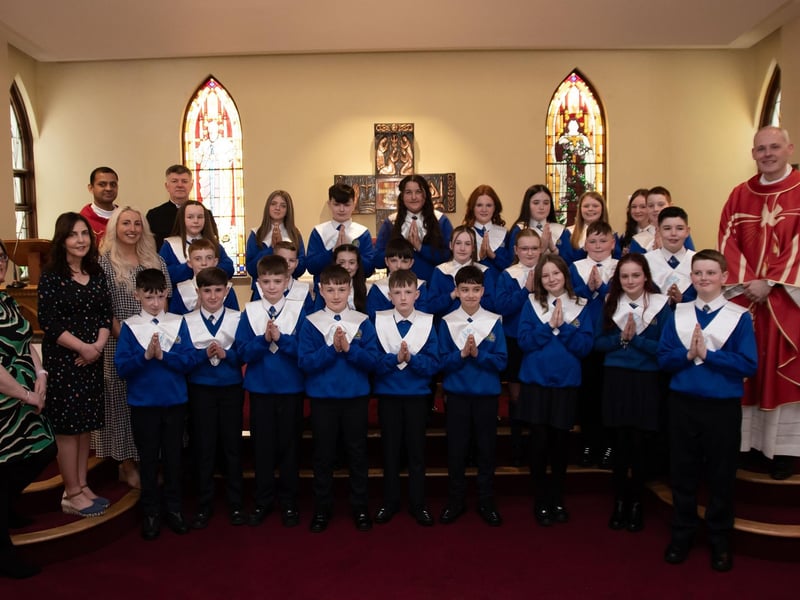 ST. PAUL'S PS CONFIRMATION . . . . .Pupils from St. Paul's Primary School who received the Sacrament of Confirmation from Fr. McGrattan at St. Joseph's Church, Galliagh on Friday last. Included in photo, fromleft, Ms Quinn, asst, Mrs McKinney, asst, Ms McGinty, P7 teacher, Fr Roni Zacharias, Noel Gallagher, seminarian. (Photos: Jim McCafferty Photography)