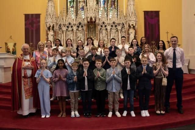 Mr. Dee Herron's P7 class at Good Shepherd Primary School who received the Sacrament of Confirmation from Fr. Michael Canny at Chapel Road Church. Included in photo is Mrs. Suzann McCafferty, Principal and Ms. Catherine Maguire, Classroom Assistant. (Photo: Jim McCafferty Photography)