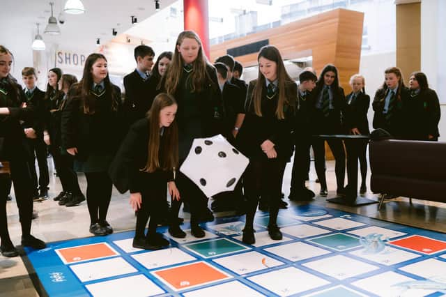 Pupils enjoying the Science of Salmon giant board game