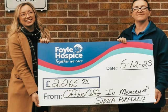 Stephanie presents the money she raised in memory of her Granny Sheila to Kathleen Bradley, Foyle Hospice Fundraising Officer