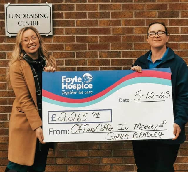 Stephanie presents the money she raised in memory of her Granny Sheila to Kathleen Bradley, Foyle Hospice Fundraising Officer