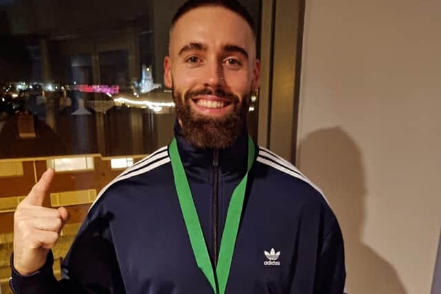 Daniel shows off his Irish Championship gold medal, won less than six months after taking up rowing.
