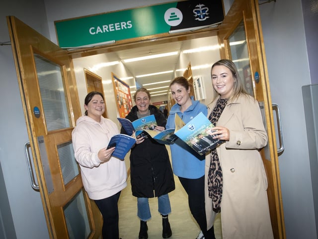 MUMS - R - US!. . .Mums of St. Eithne's PS pupils take time out on Saturday to read up on the St. Columb's prospectus. From left, Emma Chambers, Clare Foley, Claire Dolan and Chantelle Boyle. (Photos: Jim McCafferty Photography) : .