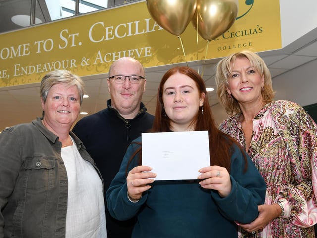Mrs O'Carolan, Principal, pictured with Aine Moore and her proud parents Edel and Brendan, at St. Cecilia's College on Thursday morning.