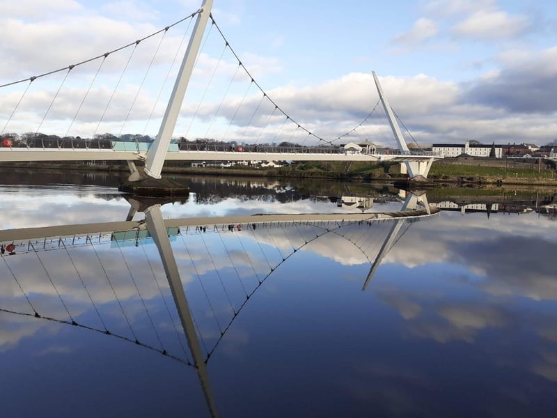 The Peace Bridge is a much-loved piece of Derry architecture enabling pedestrians and cyclists to cross the river between Ebrington and the quay at the city centre. The path is very smooth and even, although there is a grid running through the centre of the path, which starts on the left hand side and crosses over the right as you move across. There is a slight bump where this grid meets the rest of the path. The bridge is higher on the Ebrington side so there is a slight incline when walking towards the Waterside. For people who can travel longer distances, it's possible to park on the Foyle Road or Victoria Market and walk over the Craigavon Bridge, returning via the Peace Bridge. There are no public toilets in the area, although the Guildhall is nearby on the city side and there are public toilets in Ebrington.