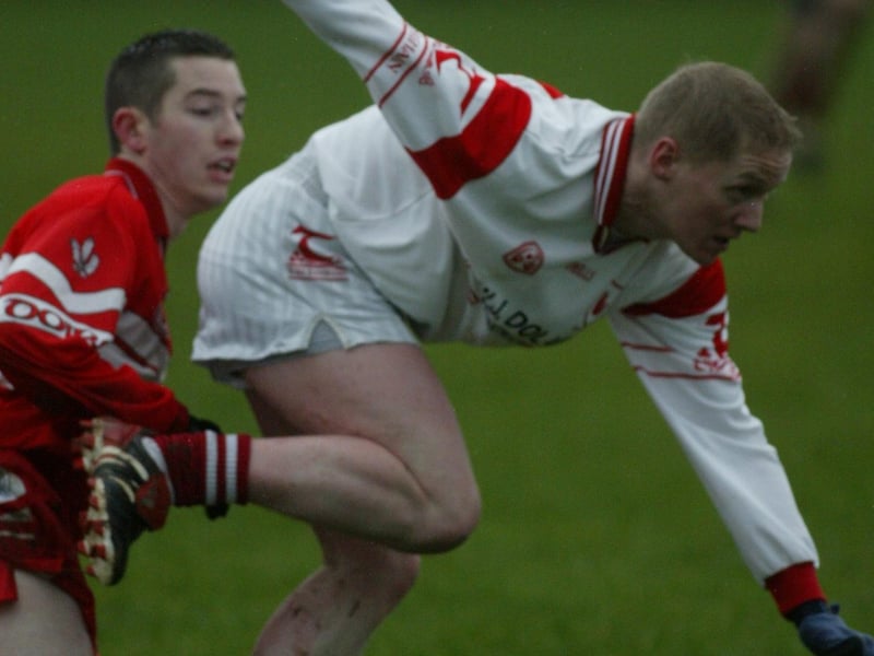 Derry's Dermot Scullion tracks Tyrone forward Colm McCullagh during the McKenna Cup meeting in January 2004.