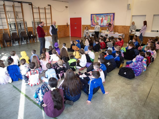 Mr. Feargal Friel introduces Mr. Philip O'Neill from the Culmore Community Hub, who read to the pupils during World Book Day on Thursday at Hollybush PS. (Photos: Jim McCafferty Photography)