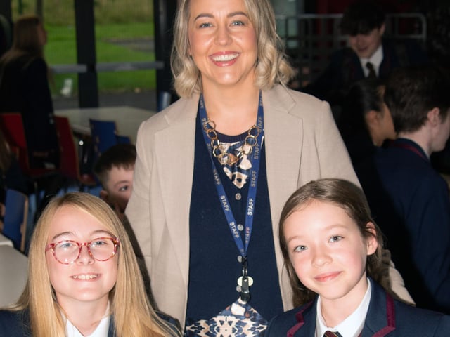Oakgrove Integrated College Vice Principal, Mrs. Kellie-Marie Martin pictured with two of the new Year 8 pupils on Monday. : Oakgrove Integrated College welcomes latest influx of Year 8 pupils