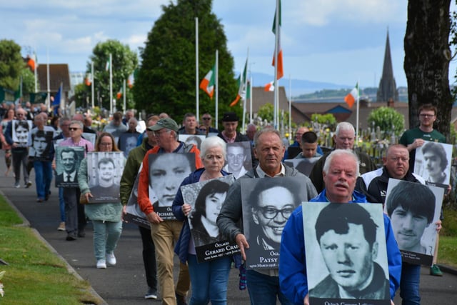 Republicans carry the portraits of loved ones killed during the conflict on Derry Volunteers Sunday.