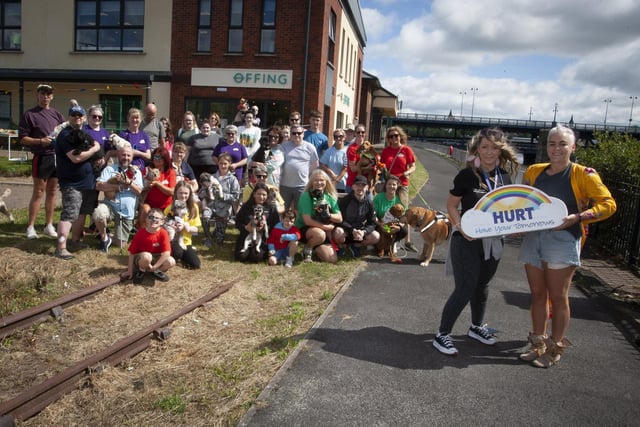 HURT ‘PAWS FOR THOUGHT’ WALK. . . . .Leeann Doherty, organiser pictured with owners and their dogs who took part in Saturday’s ‘Paws for Thought’ Doggy Walk from Destined, Foyle Road to Out The Line. (Photos; Jim McCafferty Photography)