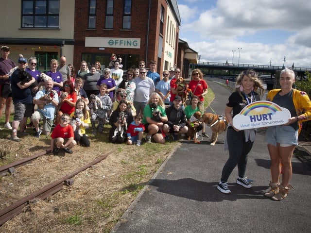 HURT ‘PAWS FOR THOUGHT’ WALK. . . . .Leeann Doherty, organiser pictured with owners and their dogs who took part in Saturday’s ‘Paws for Thought’ Doggy Walk from Destined, Foyle Road to Out The Line. (Photos; Jim McCafferty Photography)