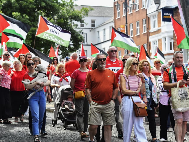 The ‘Turn Shipquay Street Red for Gaza’ march makes its way down Shipquay Street on Saturday afternoon. Photo: George Sweeney