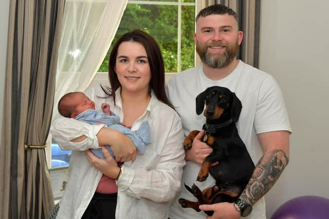 Toireasa and Barry McGavigan pictured with their baby girl Cobhlaith and Hero their dog. Photo: George Sweeney.  DER2319GS – 38