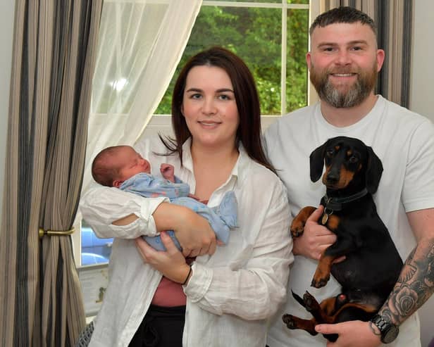 Toireasa and Barry McGavigan pictured with their baby girl Cobhlaith and Hero their dog. Photo: George Sweeney.  DER2319GS – 38