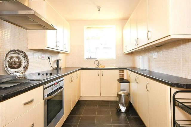 The lengthy kitchen offers lots of storage and provides plenty of space for the appliances you need.
