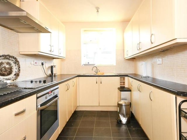 The lengthy kitchen offers lots of storage and provides plenty of space for the appliances you need.