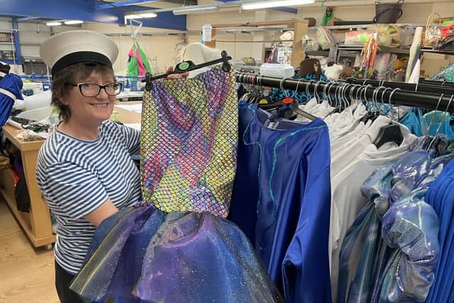NW Carnival Initiative costume designer Helen Quigley pictured putting the final touches to some of the stunning costumes.