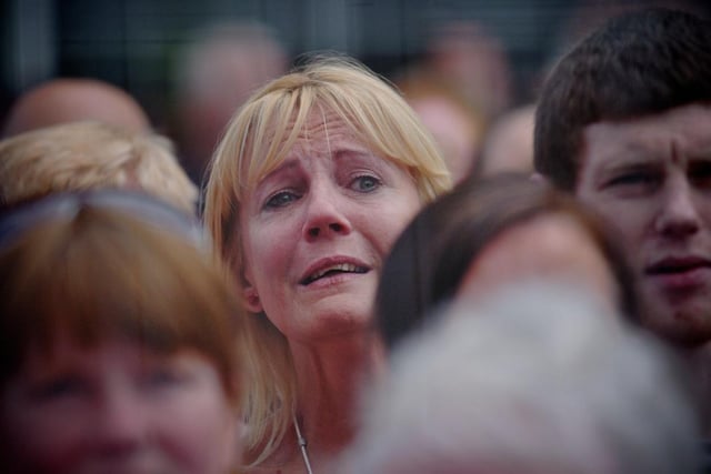 One of the crowd shows her emotions as the Bloody Sunday dead are cleared by the Saville Inquiry. (1506SL118) Photo: Stephen Latimer