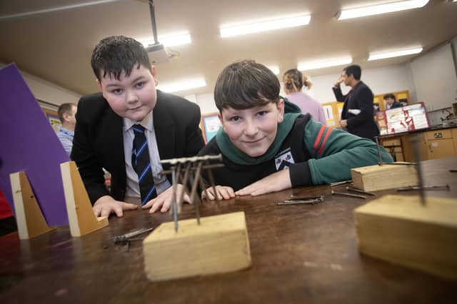 St. Columb's College student Corey helping Sacred Heart PS pupil Jake with the 'Nail Experiment' at St. Columb's College Open Day on Saturday. (Photos: Jim McCafferty Photography) : .