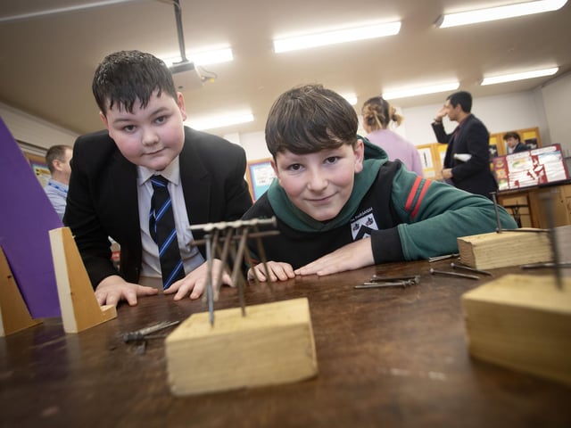St. Columb's College student Corey helping Sacred Heart PS pupil Jake with the 'Nail Experiment' at St. Columb's College Open Day on Saturday. (Photos: Jim McCafferty Photography) : .