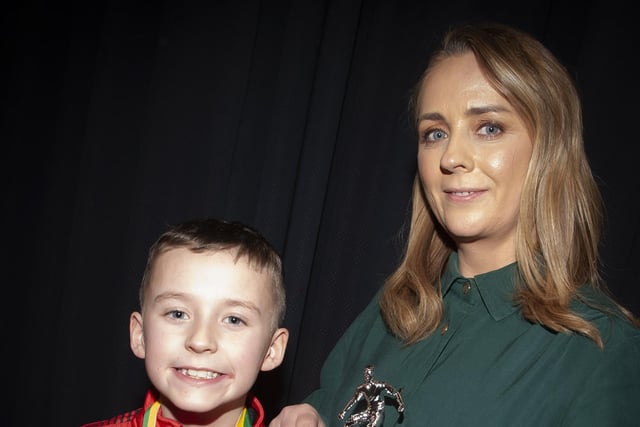 Caroline Casey, manager, O’Neills Sports Superstore, Derry presenting the U8 Premier Summer Plate to Oisin Gallagher, captain, Phoenix Athletic FC at the Annual Awards in the City Hotel on Friday night last.