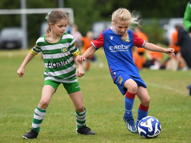 Top Of The Hill Celtic's Stella Mullan keeps close tabs on Linfield forward Katie Lyness during their girls under-9's match.