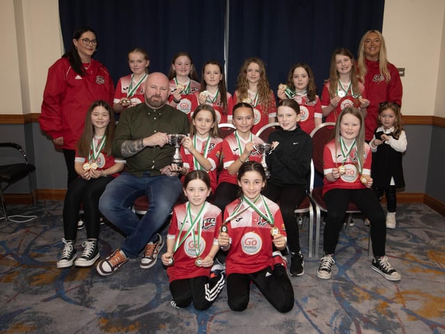Shaun and Faith Taylor presenting the Emily Taylor Memorial Cup to Maiden City Soccer u-10s at the Annual D&D Awards Night on Saturday at the City Hotel. Included are coaches Nicole Glonicka and Jennifer Brown.