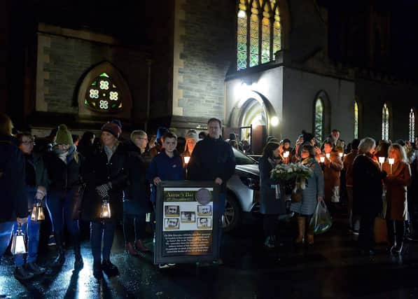 Relatives gather after mass at St Columba’s Church to take part in a wreath laying event, at Strabane Old Road, on the 50th Anniversary of the Annie’s Bar massacre on Tuesday evening. Photo: George Sweeney. DER2251GS – 11