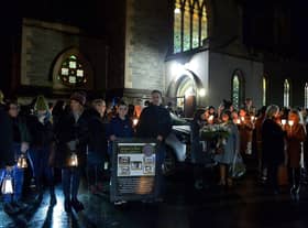 Relatives gather after mass at St Columba’s Church to take part in a wreath laying event, at Strabane Old Road, on the 50th Anniversary of the Annie’s Bar massacre on Tuesday evening. Photo: George Sweeney. DER2251GS – 11