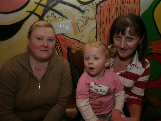 Abbie poses for the photographer with her granny Donna and granny Therese 0004/JML : Parties and celebrations January 2006: Abbie Simpson.