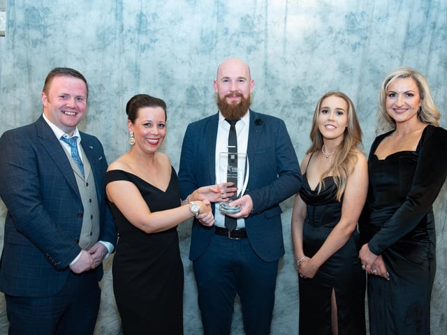 Bryan McCandless, Mark 2 Menswear collects the Retailer of the Year Award sponsored by Bank of Ireland from Louise McDermott, Bank of Ireland at the Carndonagh Traders Business and Community Awards in the Ballyliffin Lodge Hotel on Saturday night last also included from left are Gary McKeague, Ciara McCloskey and CArol Anne Wilson. Photo Clive Wasson.