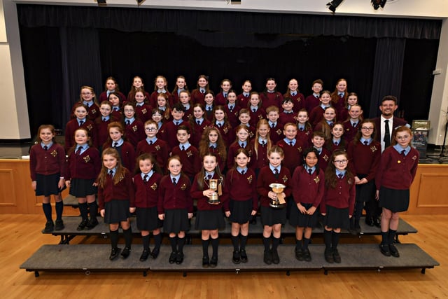 St Eithne’s Primary School winners of the Bishop Daly Feis Cup and Bursary at the Feis Dhoire Cholmcille Choral Competitions held in St Mary’s College. Included in the photograph is Vice-Principal of St Eithne’s, Sean Conaghan. Photo: George Sweeney