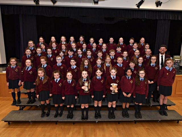 St Eithne’s Primary School winners of the Bishop Daly Feis Cup and Bursary at the Feis Dhoire Cholmcille Choral Competitions held in St Mary’s College. Included in the photograph is Vice-Principal of St Eithne’s, Sean Conaghan. Photo: George Sweeney