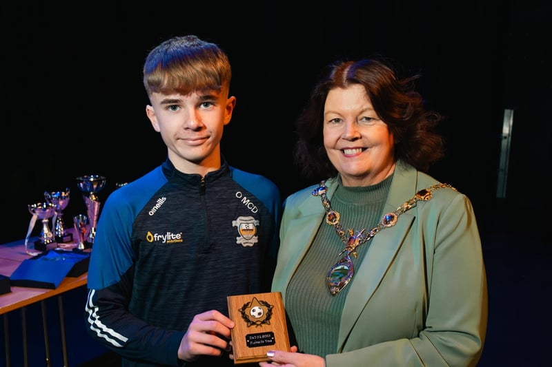 Derry City & Strabane District Council Mayor Patricia Logue making a presentation to Ollie McDaid, who won the D&D FA 2023 Player of the Year Award. Photo: Karol McGonigle, Milkwood Studios.